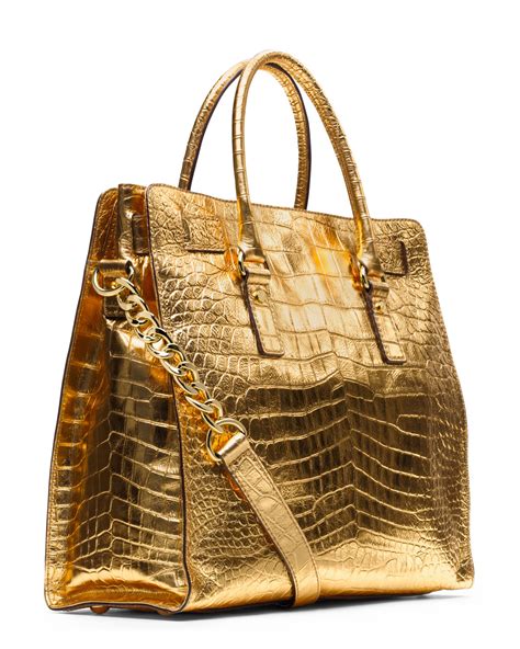 michael kors gold purse lock|Michael Kors large gold tote.